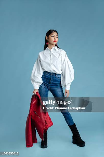 beautiful woman posing with leather jacket - jacket sleeve stock pictures, royalty-free photos & images