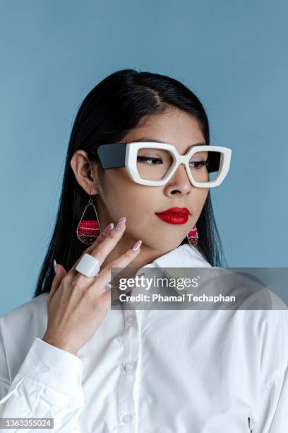 beautiful woman wearing glasses - drop earring stock-fotos und bilder