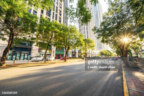 city street at sunset - 道路 ストックフォトと画像