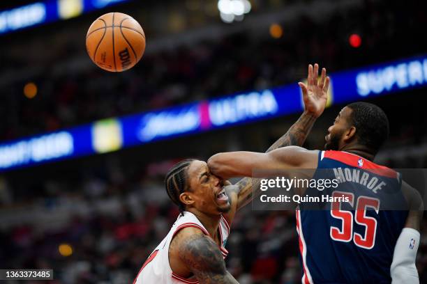 DeMar DeRozan of the Chicago Bulls is fouled in the second half by Greg Monroe of the Washington Wizards at United Center on January 07, 2022 in...