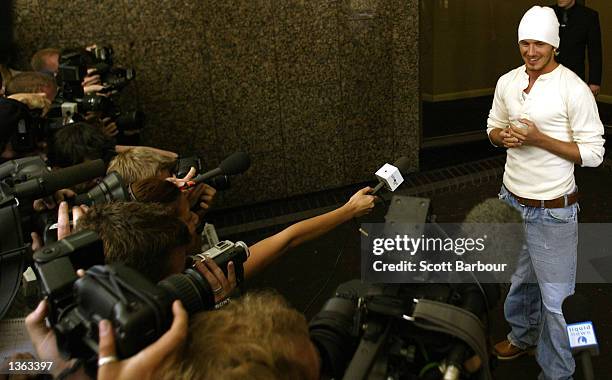 Soccer player David Beckham greets the media as he announces the birth of his baby boy, Romeo, at Portland Hospital September 1, 2002 in London,...