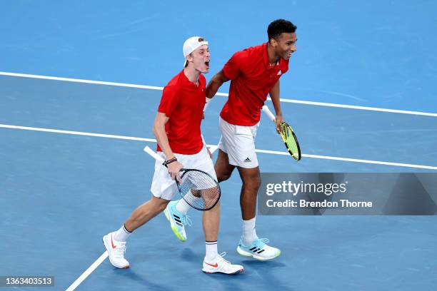 Denis Shapovalov and Felix Auger-Aliassime of Canada celebrate match point in their semi final match against Roman Safiullin and Daniil Medvedev of...