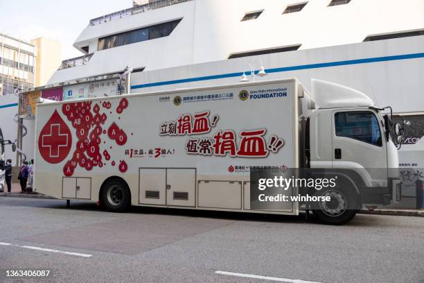 mobile blood donation vehicle in hong kong - blood donation truck stock pictures, royalty-free photos & images