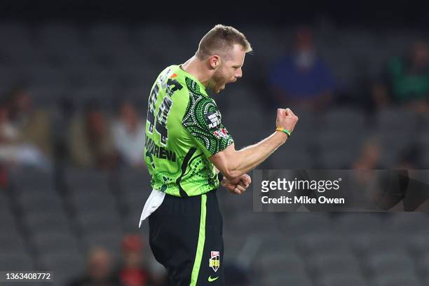 Nathan McAndrew of the Thunder celebrates after dismissing Will Sutherland of the Renegades during the Men's Big Bash League match between the...