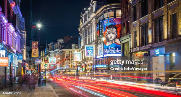 london shaftesbury avenue west end theatre district illuminated nightlife panorama - soho london night stock pictures, royalty-free photos & images