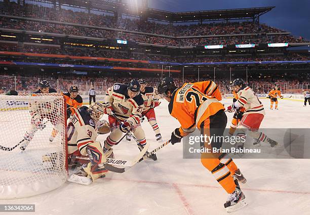 James van Riemsdyk of the Philadelphia Flyers is denied by goaltender Henrik Lundqvist of the New York Rangers during the 2012 Bridgestone NHL Winter...