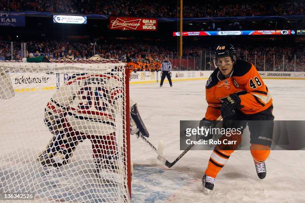 Henrik Lundqvist of the New York Rangers makes a save on a penalty shot by Danny Briere of the Philadelphia Flyers late in the third period during...