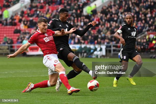 Chris Martin of Bristol City has a shot on goal whilst under pressure from Tosin Adarabioyo of Fulham during the Emirates FA Cup Third Round match...