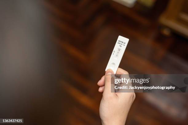 positive cassette rapid test for covid-19, test result by using rapid test device for covid-19 novel coronavirus. - coronavirus test stock pictures, royalty-free photos & images