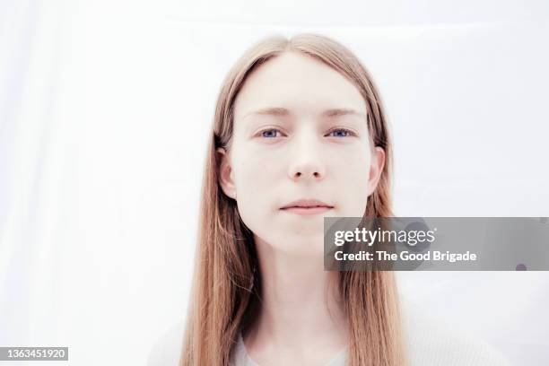 headshot of transgender female in studio - pale complexion stock-fotos und bilder