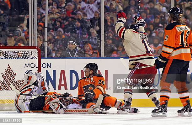 Brad Richards of the New York Rangers celebrates his game-winning goal against Sergei Bobrovsky and Claude Giroux of the Philadelphia Flyers during...