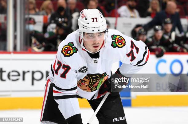 Kirby Dach of the Chicago Blackhawks gets ready during a face off against the Arizona Coyotes at Gila River Arena on January 06, 2022 in Glendale,...