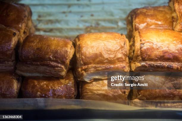 sausage rolls on sale at market - sausage roll stock-fotos und bilder