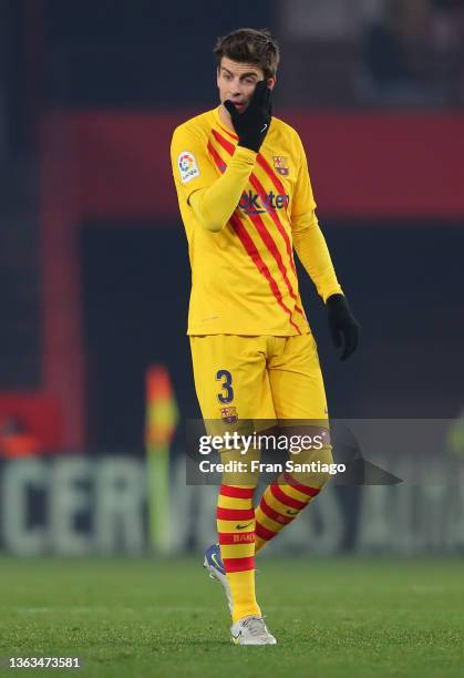 Gerard Pique of FC Barcelona reacts during the La Liga Santader match between Granada CF and FC Barcelona at the Nuevo Estadio de Los Cármenes in...