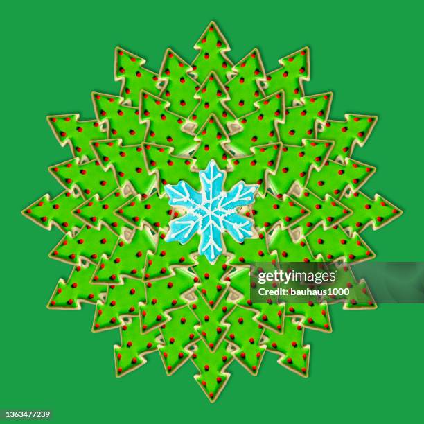 christmas tree and snowflake: christmas wreath created using festive decoratively iced christmas cookies - cookie decorating stock illustrations