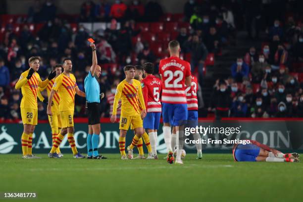 Referee shows a red card to Gavi of FC Barcelona during the La Liga Santander match between Granada CF and FC Barcelona at the Nuevo Estadio de Los...