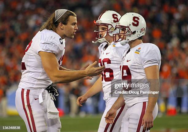 Alex Debniak of the Stanford Cardinal consoles kicker Jordan Williamson after he missed a potential game-winning field goal attempt in the fourth...