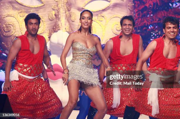 Indian Bollywood actress and model Lisa Haydon performs with dancers during New Year eve celebrations in Aamby Valley in the outskirt of Mumbai on...