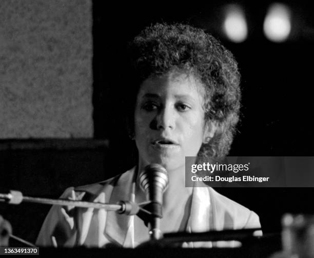 American Folk and Pop musician Janis Ian plays piano as she performs onstage at an unspecified venue, East Lansing Michigan, August 3, 1981.