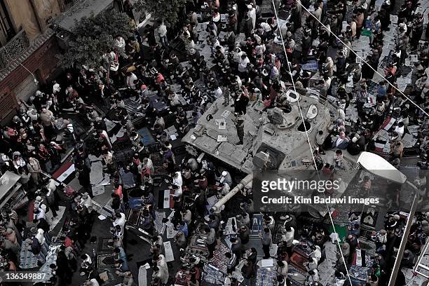 Peaceful protesters pray near and army tank on Tahrir Street on February 10, 2011 off of Tahrir Square in downtown Cairo, Egypt.
