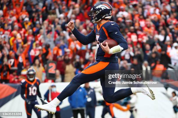 Drew Lock of the Denver Broncos rushes for a touchdown during the first quarter against the Kansas City Chiefs at Empower Field At Mile High on...