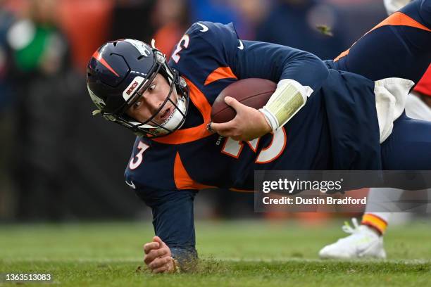 Drew Lock of the Denver Broncos rushes for a touchdown during the second quarter against the Kansas City Chiefs at Empower Field At Mile High on...