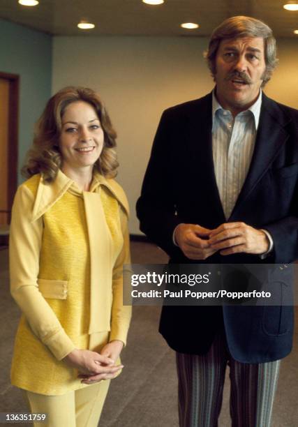 Singer and actor Howard Keel and his wife Judy at Heathrow Airport near London, circa June 1971.