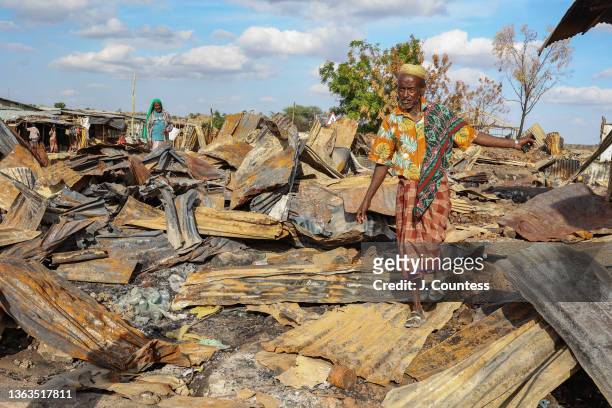 Ali Adem of Darsageta walks through the wreckage that was once his home and business on January 07, 2022 in Darsageta, Ethiopia. During the TPLF...