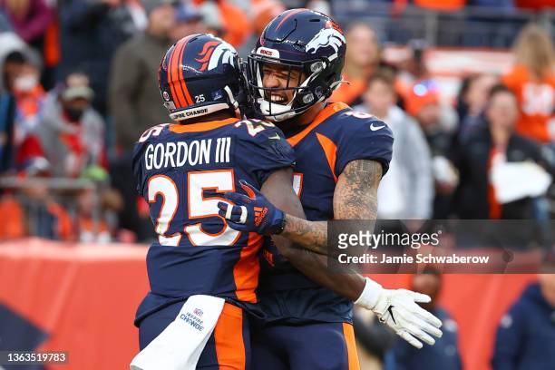 Melvin Gordon of the Denver Broncos celebrates with Tim Patrick following his touchdown run during the third quarter against the Kansas City Chiefs...