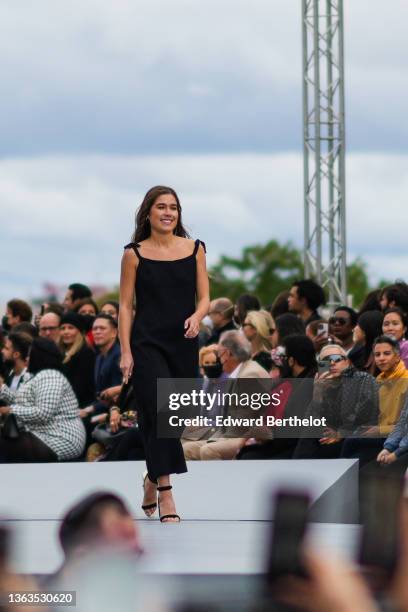 Filippa Coster-Waldau wears a black dress, and walks the runway, during the L'Oreal show, during Paris Fashion Week - Womenswear Spring Summer 2022,...