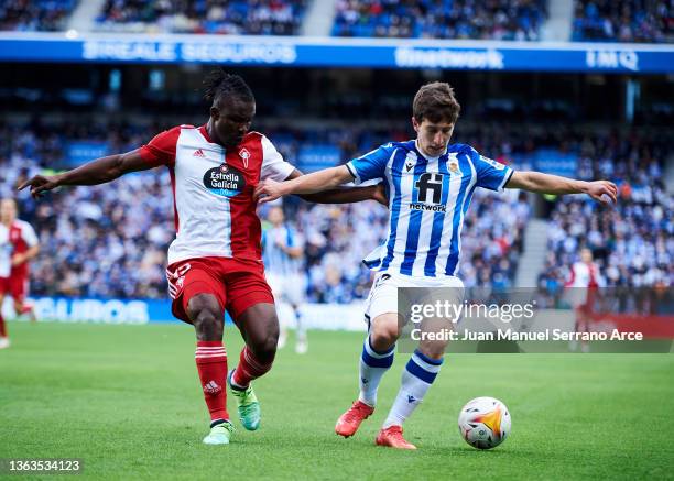 Aihen Munoz of Real Sociedad duels for the ball with Joseph Aidoo of Celta de Vigo during the La Liga Santader match between Real Sociedad and RC...