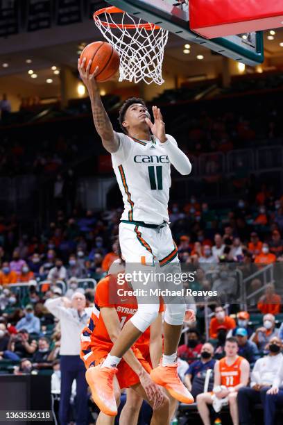 Jordan Miller of the Miami Hurricanes goes up for a layup against the Syracuse Orange during the first half at Watsco Center on January 05, 2022 in...