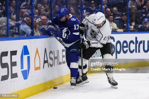 Alex Killorn of the Tampa Bay Lightning skates against Anze Kopitar of the Los Angeles Kings during the first period at Amalie Arena on December 14,...