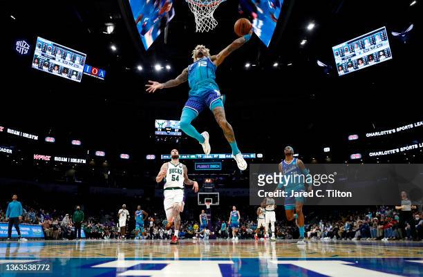 Kelly Oubre Jr. #12 of the Charlotte Hornets dunks the ball during the second half of the game against the Milwaukee Bucks at Spectrum Center on...