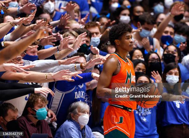 The Cameron Crazies taunt Kameron McGusty of the Miami Hurricanes as he waits to inbound the ball during the second half of their game against the...