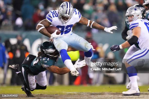 Corey Clement of the Dallas Cowboys runs with the ball as Andre Chachere of the Philadelphia Eagles defends in the fourth quarter of the game at...