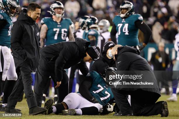 Andre Dillard of the Philadelphia Eagles is assessed for injury on the field in the fourth quarter of the game against the Dallas Cowboys at Lincoln...