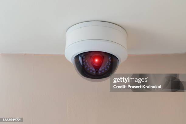 ccty on ceiling in modern building - surveillance camera stockfoto's en -beelden