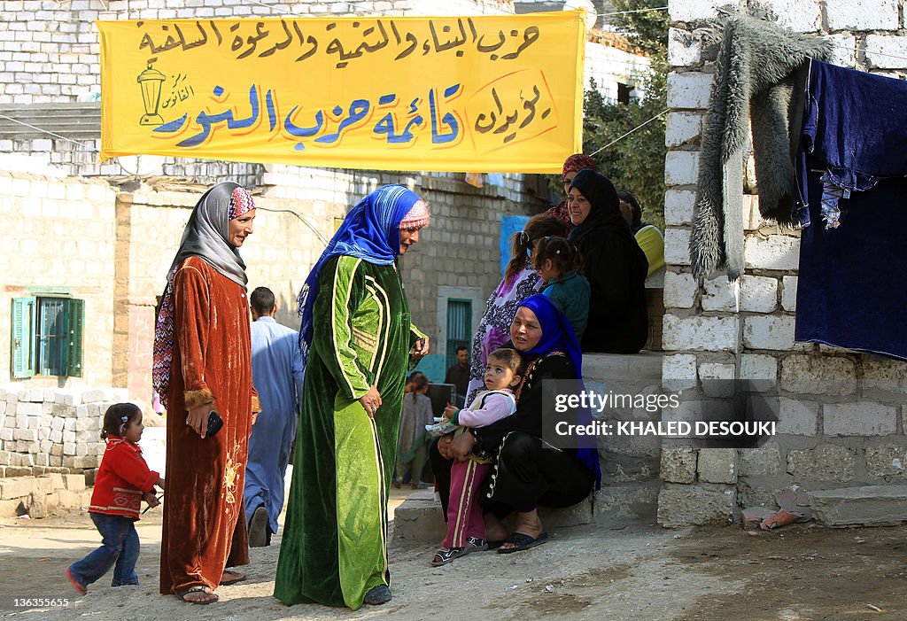 Egyptian women and children gather under