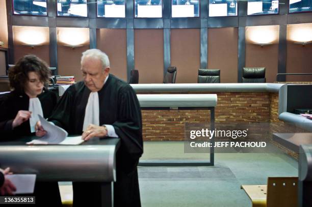 Court bailiff works on files before the beginning of the first trial gathering jury members and magistrates at the criminal chamber of Dijon's court...