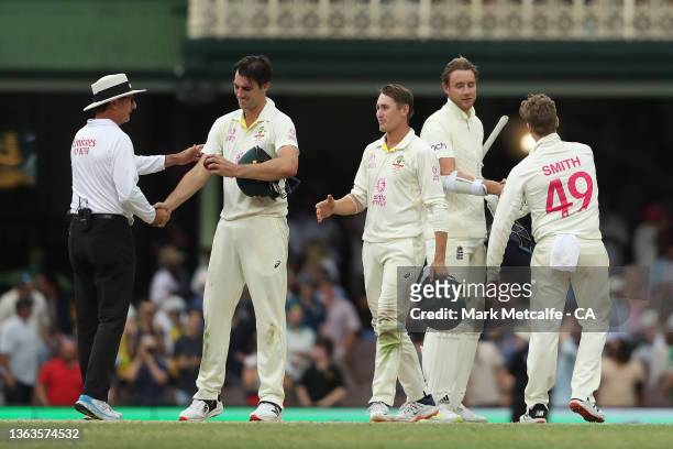 Pat Cummins of Australia shakes hands with the match umpire after the end of play during day five of the Fourth Test Match in the Ashes series...
