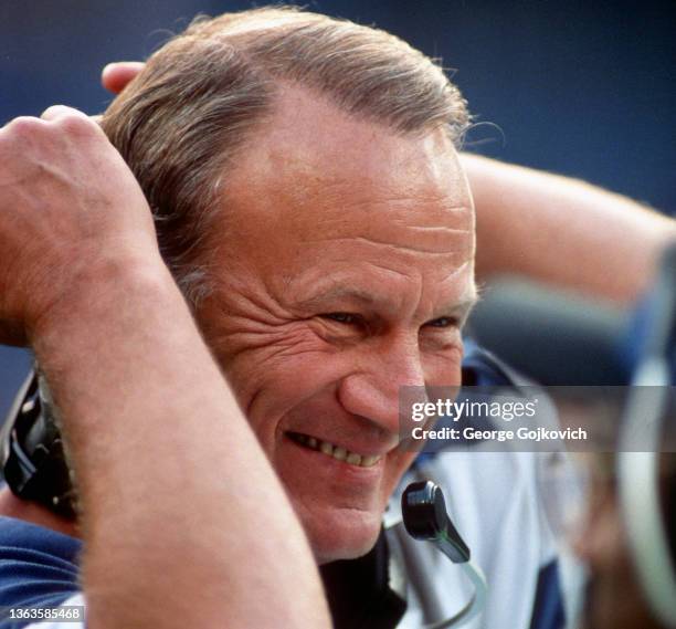 Head coach Barry Switzer of the Dallas Cowboys smiles as he adjusts his headset during a game against the Pittsburgh Steelers at Three Rivers Stadium...