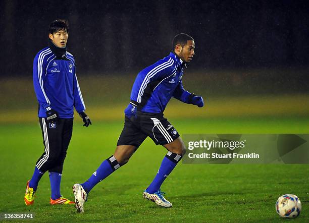 Heung Min Son and Dennis Aogo of Hamburg in action during the training session of Hamburger SV on January 3, 2012 in Hamburg, Germany.