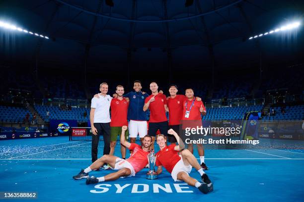 Team Canada poses for a photo with the championship trophy after victory during day nine of the 2022 ATP Cup at Ken Rosewall Arena on January 09,...