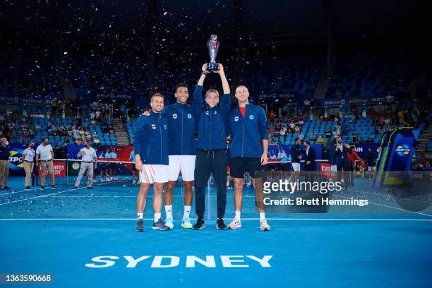 Team Canada poses for a photo with the championship trophy after victory during day nine of the 2022 ATP Cup at Ken Rosewall Arena on January 09,...
