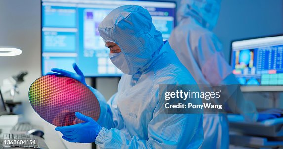 Technician with wafer Technician with wafer