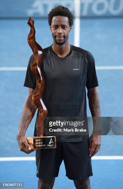 Gael Monfils of France holds the Mens Singles Champion trophy after beating Karen Khachanov of Russia in the final during day eight of the 2022...