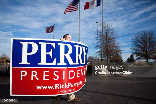 Bob DiGregorio, a supporter of Republican presidential candidate, Texas Gov. Rick Perry, leaves a caucus training session held at the Sheraton...