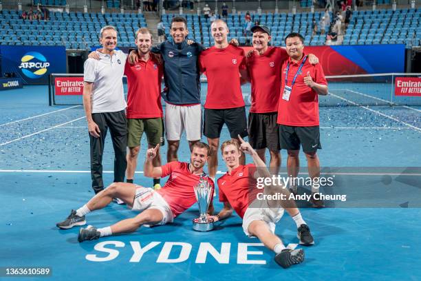 Felix Auger-Aliassime, Denis Shapovalov Steven Diez and Brayden Schnur of Team Canada celebrate winning the ATP Cup in their final match against Team...