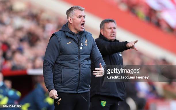 Dean Smith, Manager of Norwich City and Assistant Head Coach Craig Shakespeare give instructions during the Emirates FA Cup Third Round match between...